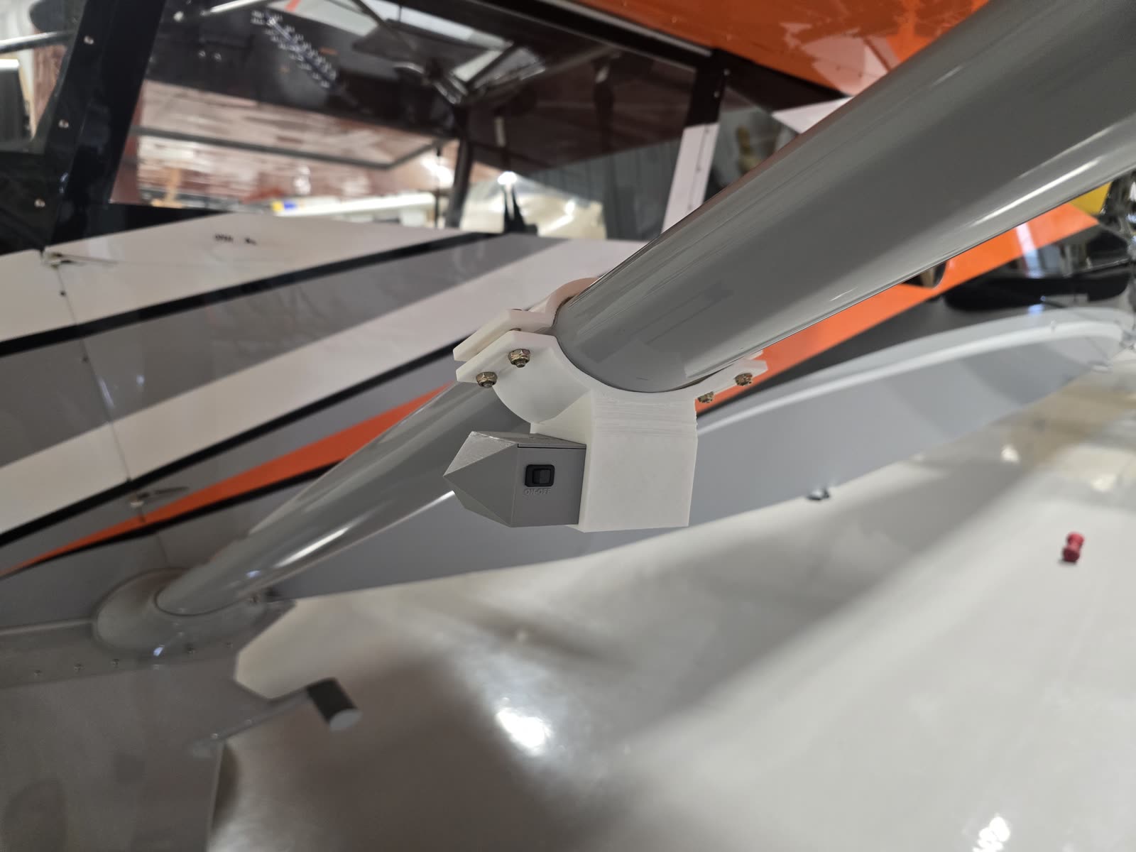 Ground Cue mounted under a wing strut on an aircraft